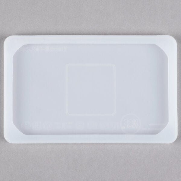 A white rectangular Flexsil steam table pan lid with a square in the middle.