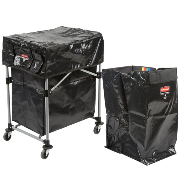 A black plastic cover on a Rubbermaid laundry cart with a black bag inside.