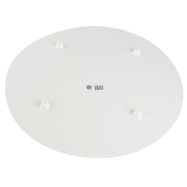 An American Metalcraft round white melamine serving board with a faux olive wood design.