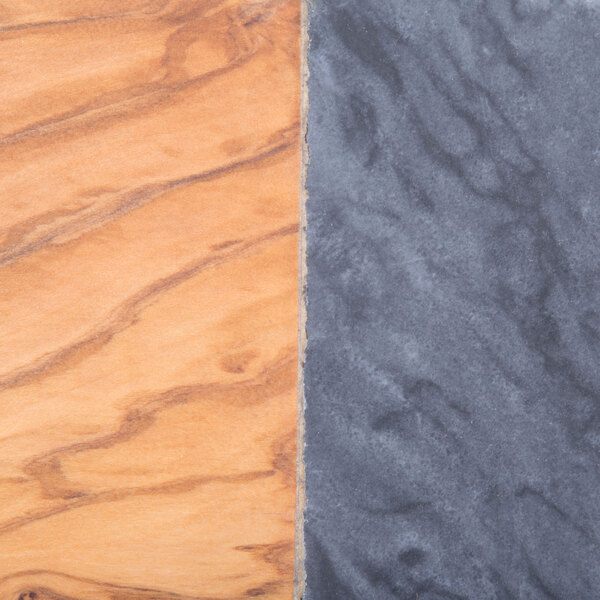 An American Metalcraft olive wood serving board with black marble accents.