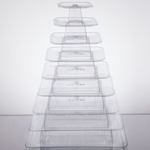 A clear plastic pyramid display stand with 9 tiers.