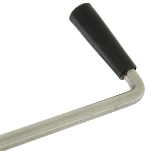 A metal twist waste valve with a black handle.