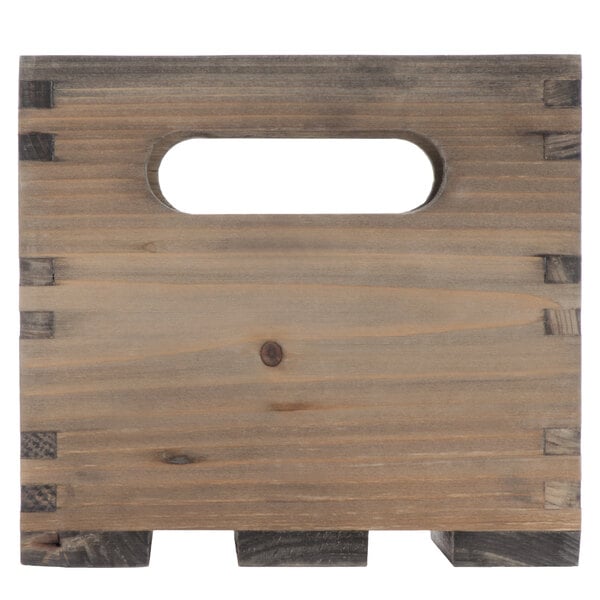 An American Metalcraft vintage wood crate with a hole in the middle.