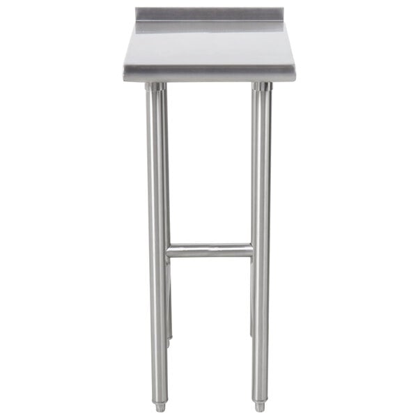 An Advance Tabco stainless steel filler table with legs.