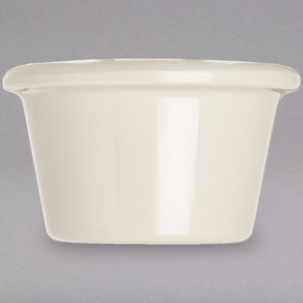 A white Carlisle ivory bone smooth melamine ramekin.