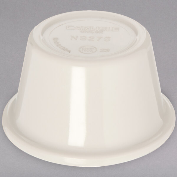 An ivory smooth melamine Carlisle ramekin with a lid on top.