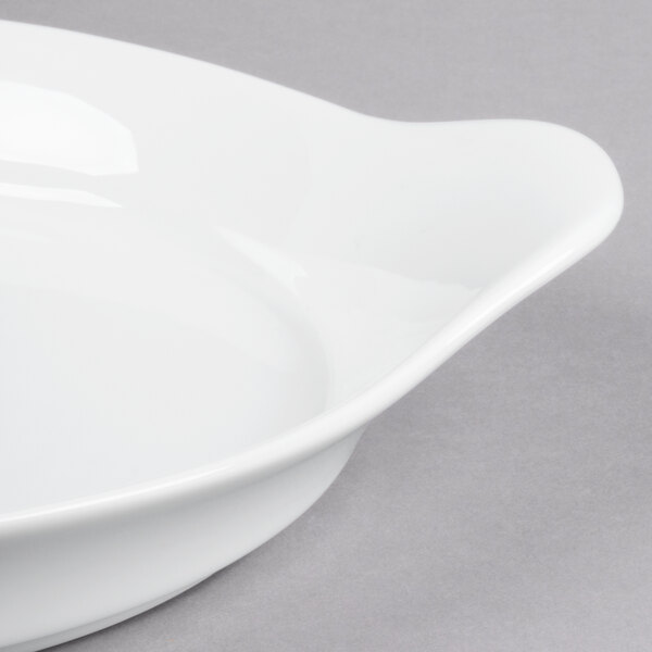 A close-up of a Libbey white porcelain handled dish.