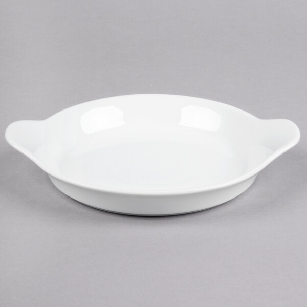 A white bowl with handles.