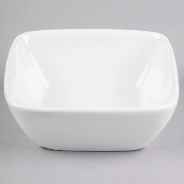 A Libbey white square bowl on a gray background.