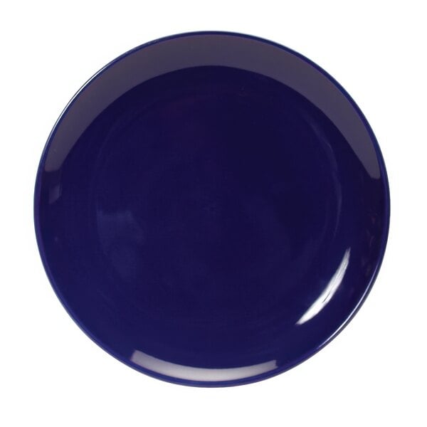 A Tuxton cobalt blue china plate with a white center and border.