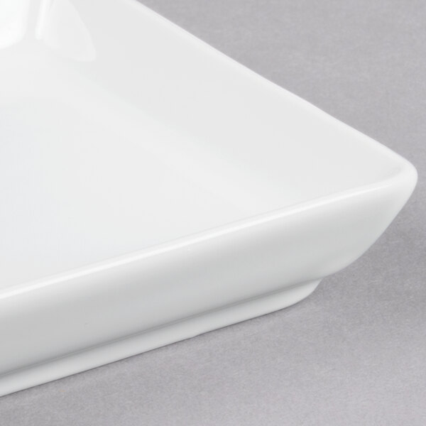 A Libbey Aluma White porcelain tray with a small square cut out in the corner.