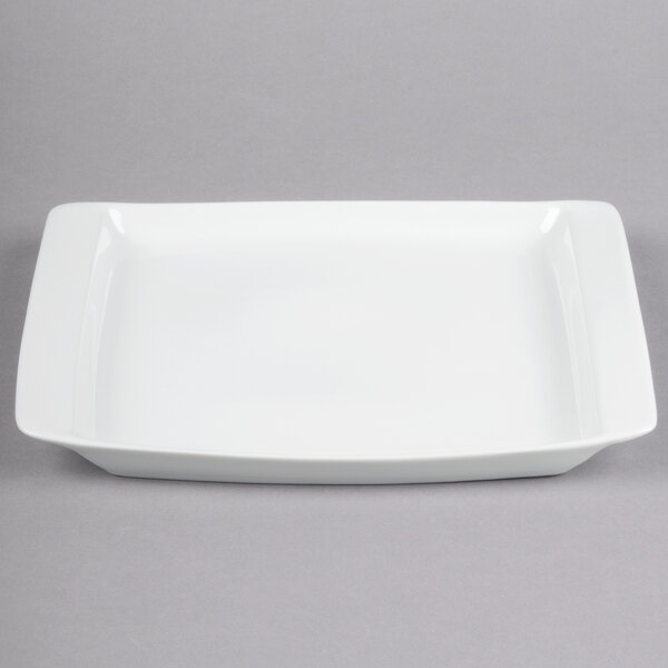 A white rectangular Libbey Aluma White porcelain platter with square edges on a gray background.