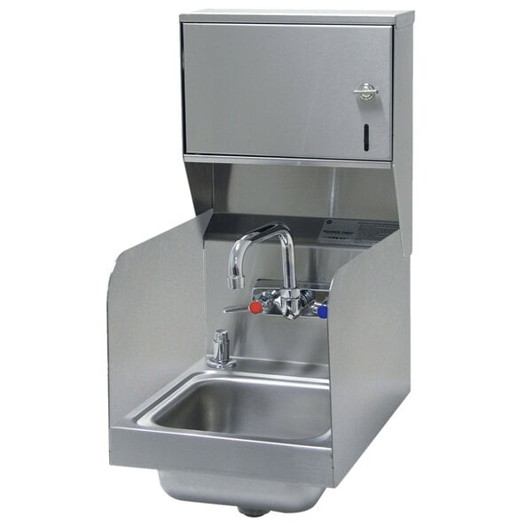 A stainless steel Advance Tabco hand sink with a splash mount faucet, side splashes, soap, and paper towel dispenser.