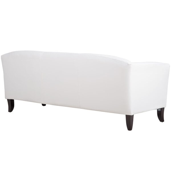 a white couch with black legs