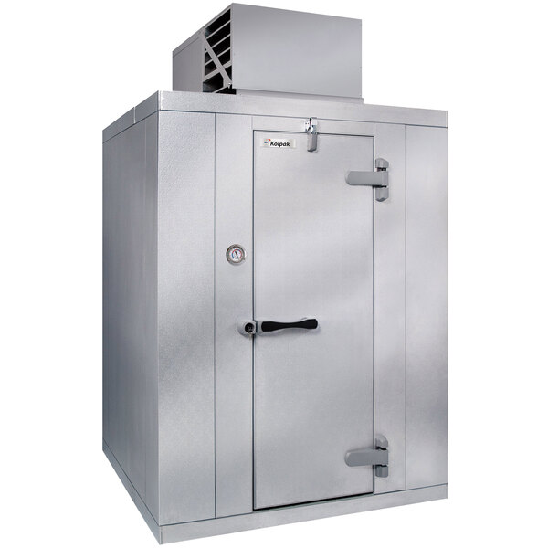 A Kolpak indoor walk-in cooler with a right hinged door open.