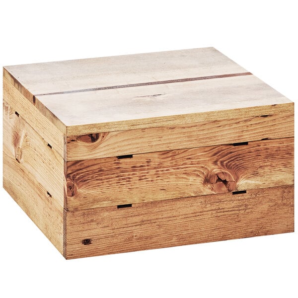 A Cal-Mil Madera rustic pine square crate riser on a table.