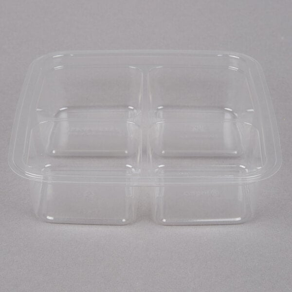 A Fabri-Kal clear plastic container with four shallow compartments.