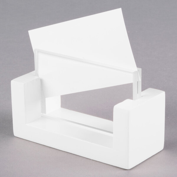 A white Cal-Mil U-frame tabletop card holder with a white card in it.