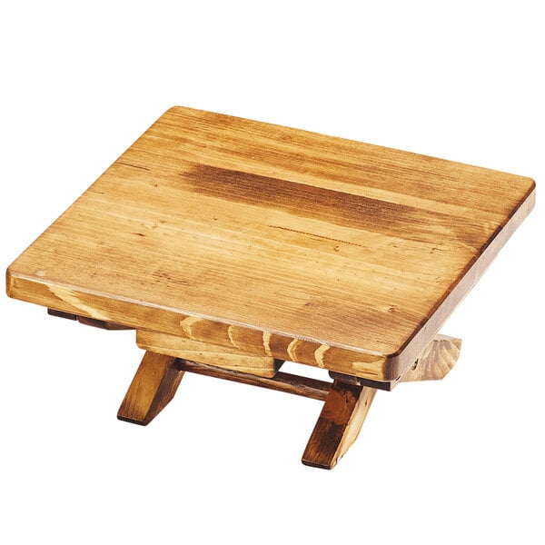 A Cal-Mil Madera rustic pine folding display riser with wooden legs.