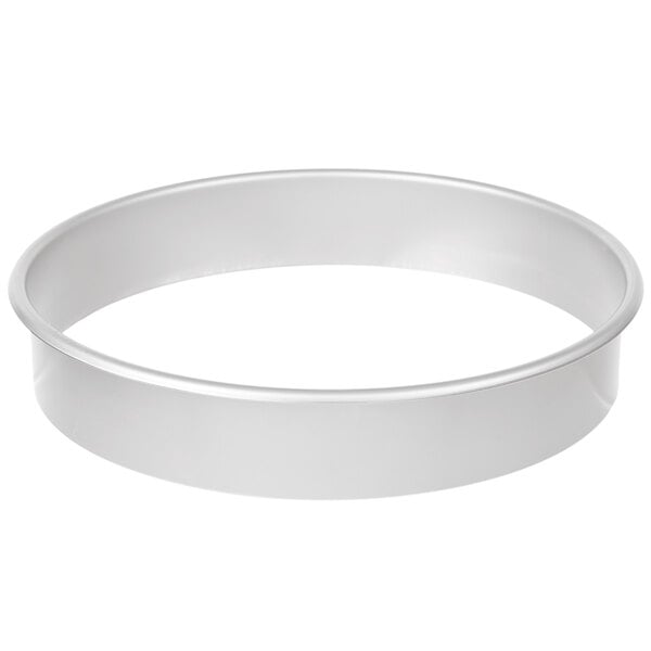 A round silver pan with a white background.