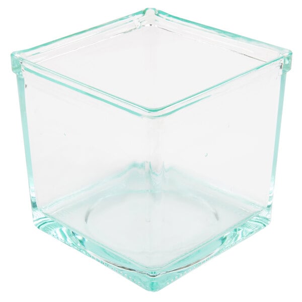 A black Cal-Mil condiment display with 4 clear square glass containers.