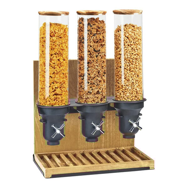 A Cal-Mil Madera triple cereal dispenser filled with three different types of cereal.
