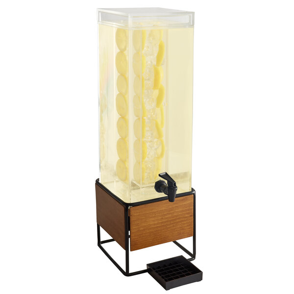 A Cal-Mil Madera beverage dispenser with a metal and wood base and infusion chamber.