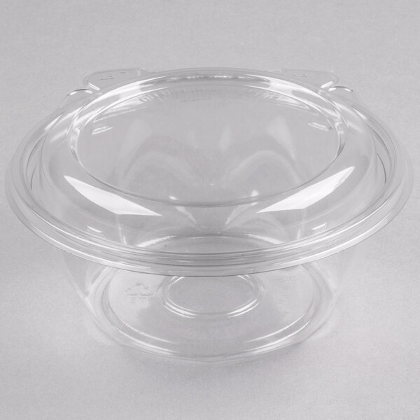 A clear Dart plastic container with a lid.