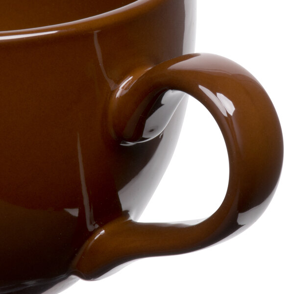 a close up of a brown mug