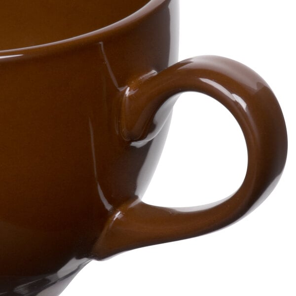 A Tuxton mahogany cappuccino cup with a handle.