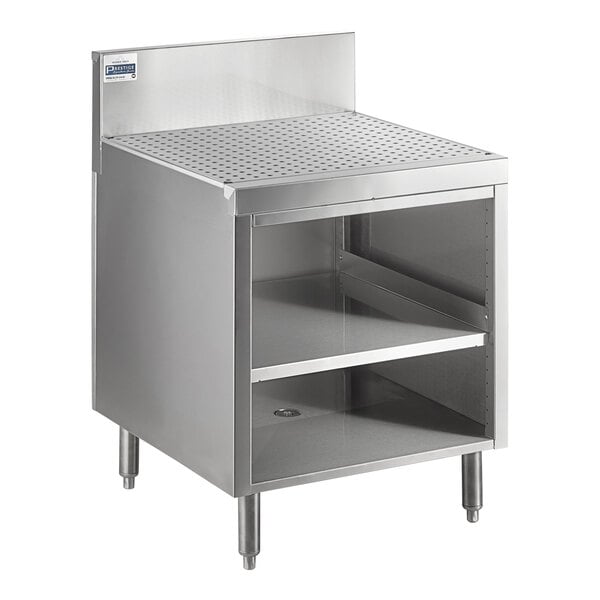 A stainless steel Advance Tabco drainboard cabinet with a shelf over a sink.