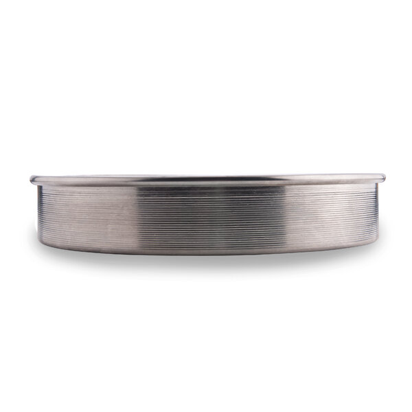 An American Metalcraft aluminum cake pan with straight sides and a metal surface.