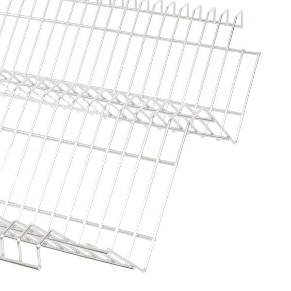 A close-up of a stainless steel Metro drop-in rack with a white background.