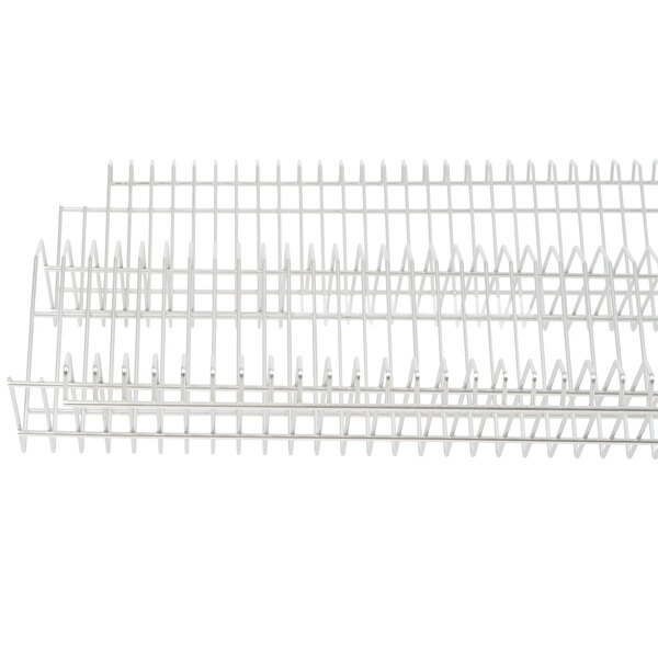 A stainless steel drop-in rack with many rows of metal on a white background.
