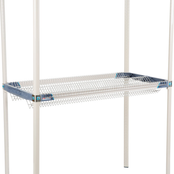A MetroMax iQ drop-in rack with a white frame and blue wire.