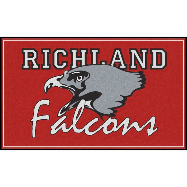 A white rectangular Notrax entrance mat with a red border and a black and white Richland Falcons logo.