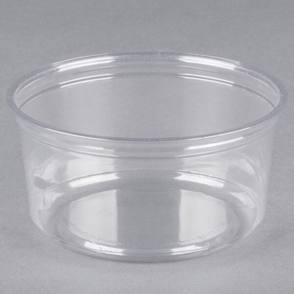 A Fabri-Kal clear plastic deli container with a lid.