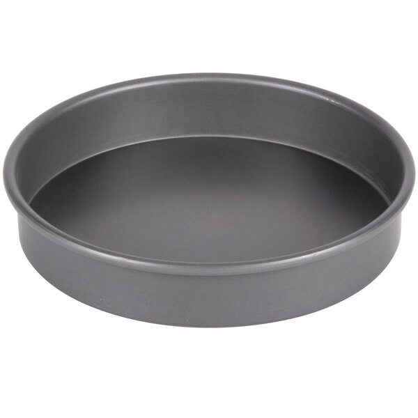 An American Metalcraft hard coat anodized aluminum round cake pan with straight sides.