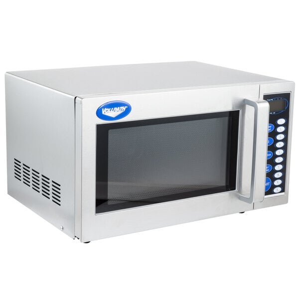 A silver stainless steel Vollrath commercial microwave with a clear window.