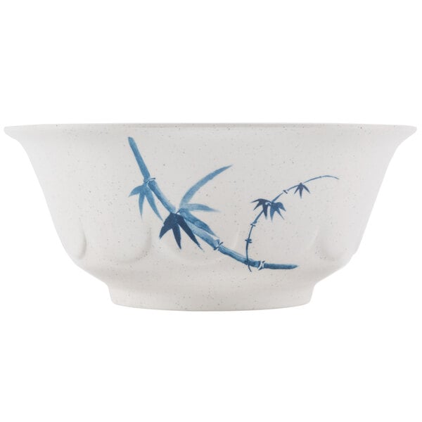 A white bowl with blue bamboo designs.