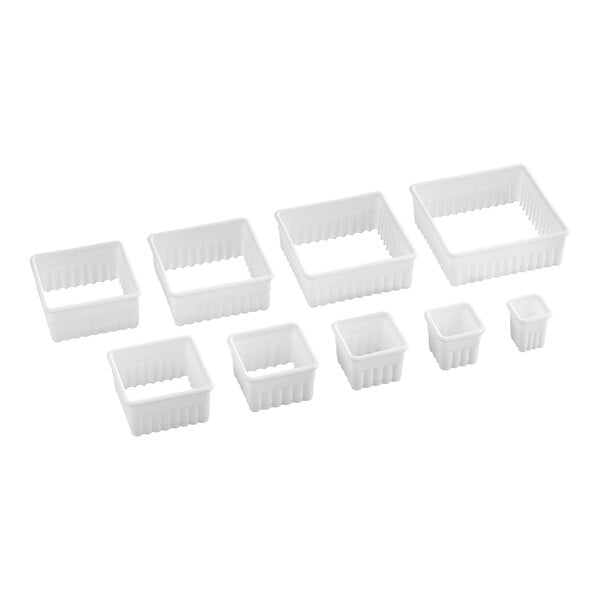 Nine white, fluted square cutters of varying sizes are arranged in two rows on a white background.