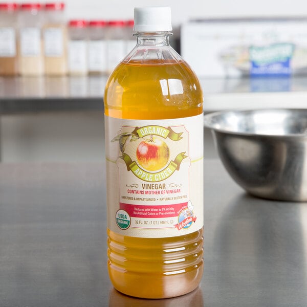 A bottle of apple cider vinegar on a kitchen counter