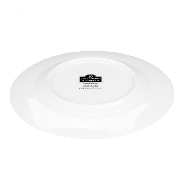 A white porcelain salad or dessert plate with a gold line, shown upside down.