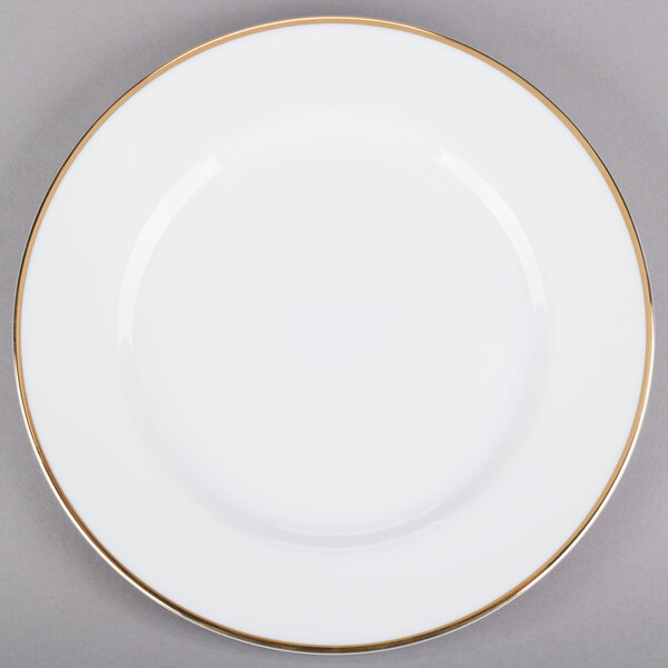A white porcelain plate with a gold rim.