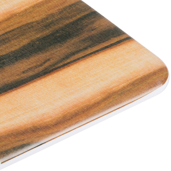 An Elite Global Solutions rectangular serving board with a faux hickory wood and Carrara marble pattern.