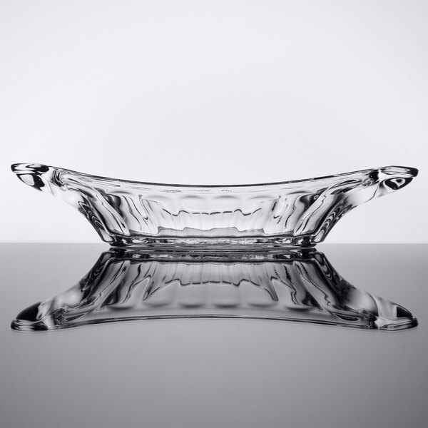 a clear glass dish with a curved edge