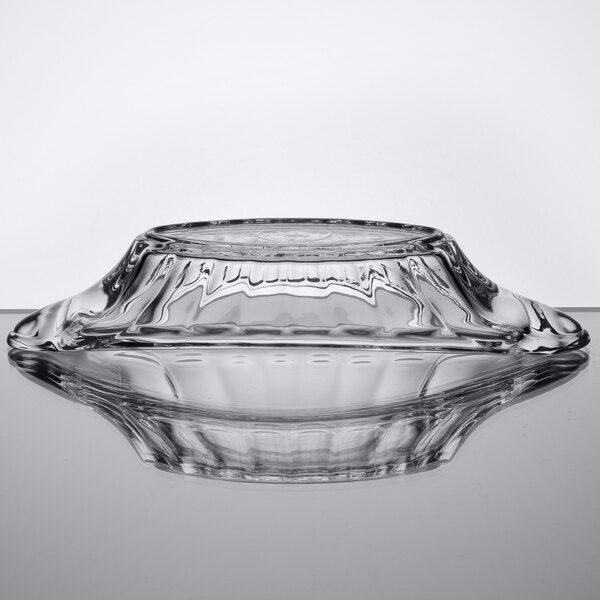 A clear glass bowl with a silver rim.