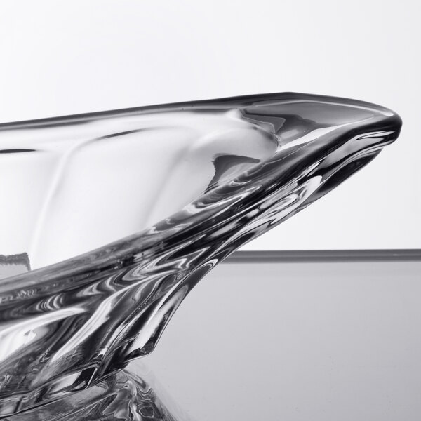 A clear Libbey glass bowl with a curved edge.