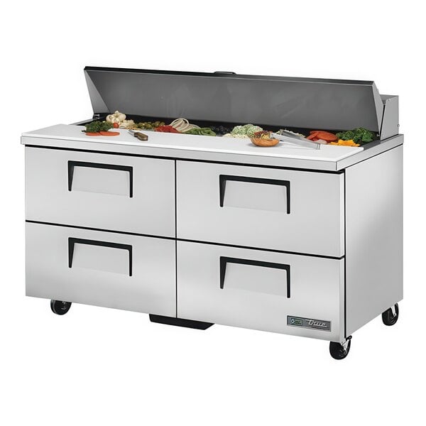 A True refrigerated sandwich prep table with four drawers in a food service setting.