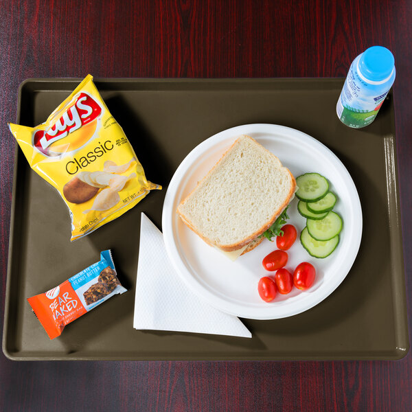 A tray with food and a drink on it.